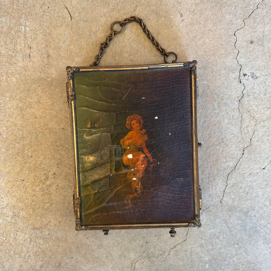 Mirror folded closed, painted panel and hanging chain
