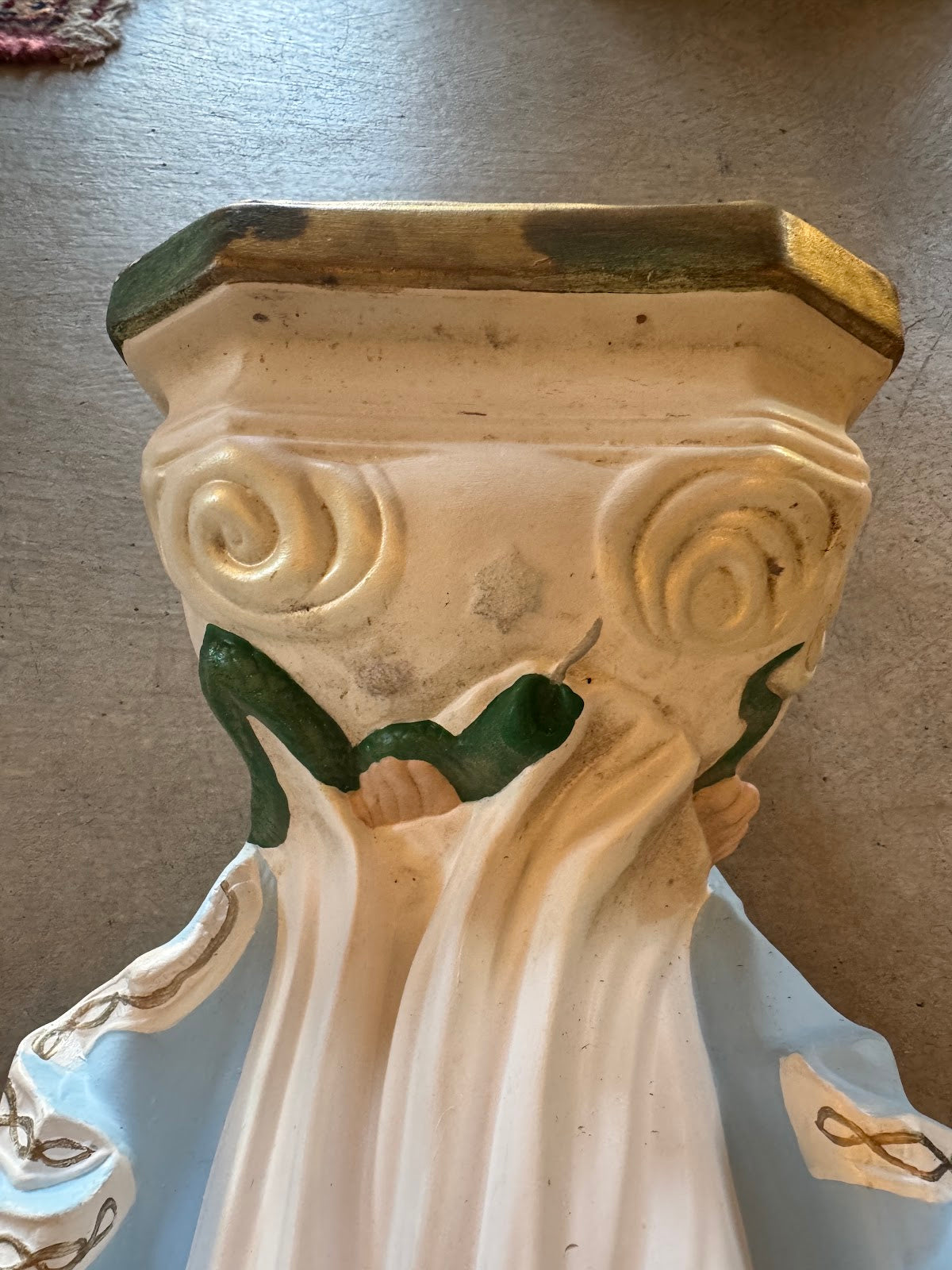 Statue base and serpent detail